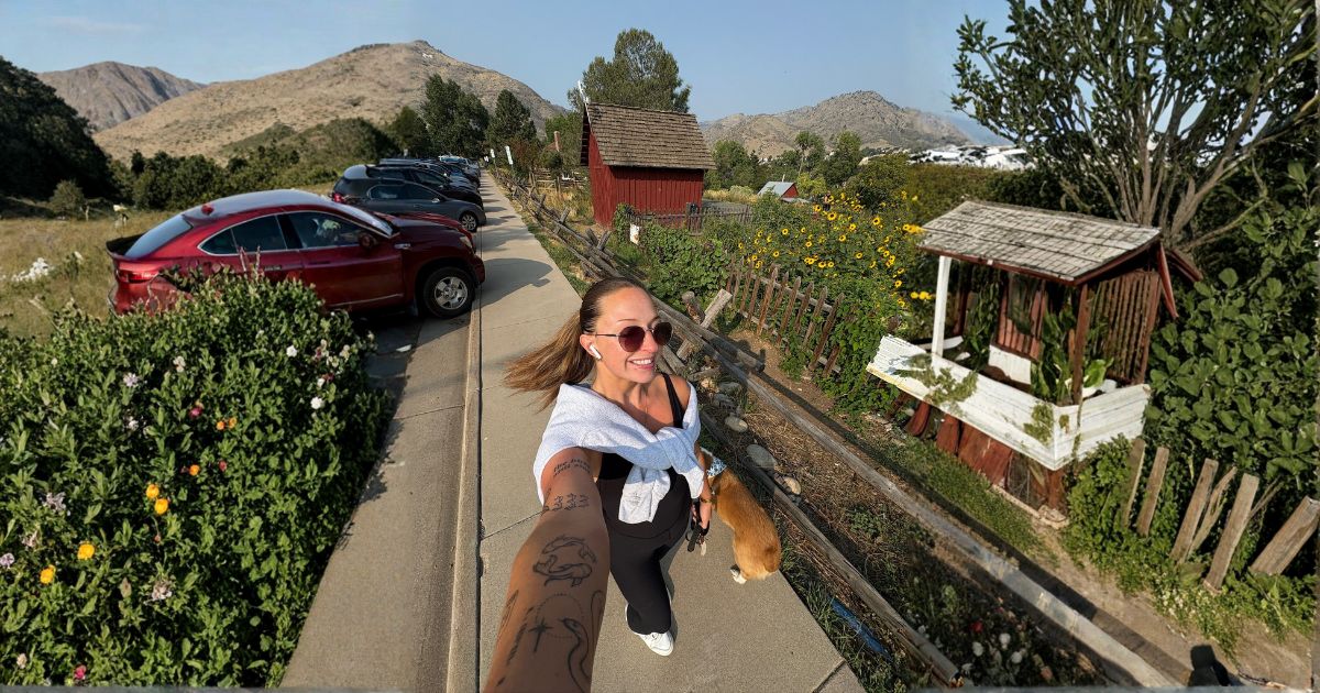 Dog owner walking dog on trail in San Antonio Texas with TreatWalk app