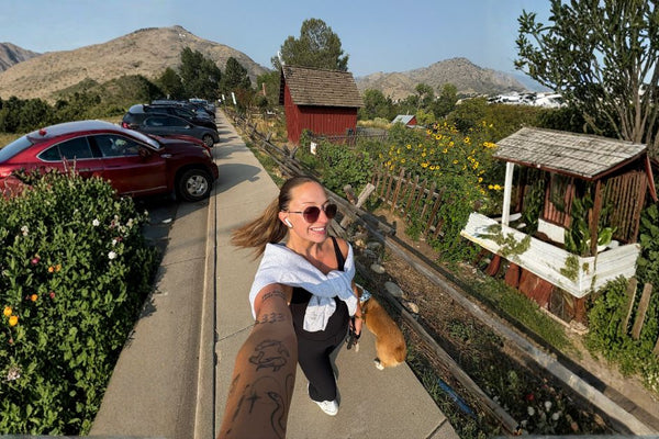 Dog owner walking dog on trail in San Antonio Texas with TreatWalk app